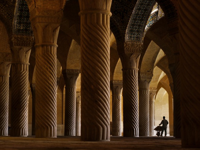 A worker inside Vakil Mosque, Shiraz.